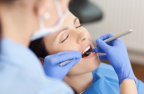 Relaxed woman receiving dental care