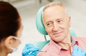 Smiling older man in dental chair