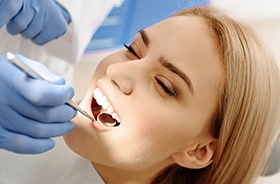 Woman receiving dental exam