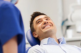 Smiling man in dental chair