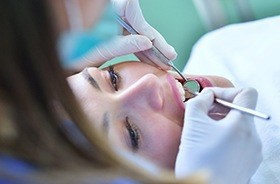 Woman receiving dental treatment