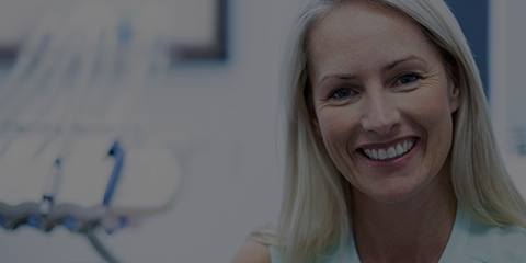 Smiling older woman at dentist